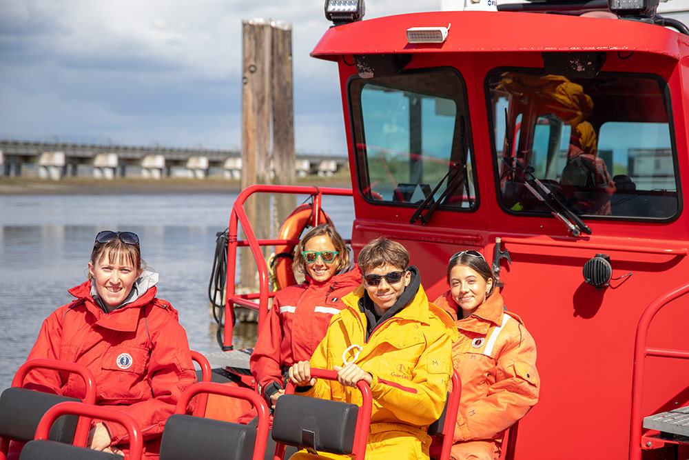 Whale watching passengers on zodiac